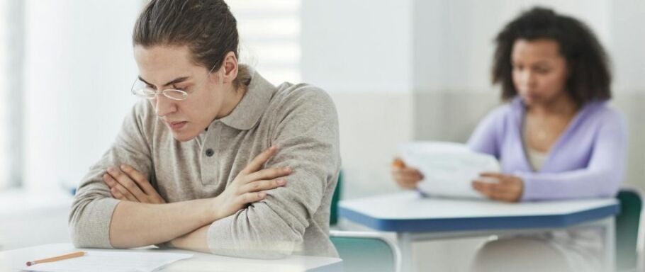 Students taking an exam, focused on academic success and college preparation.