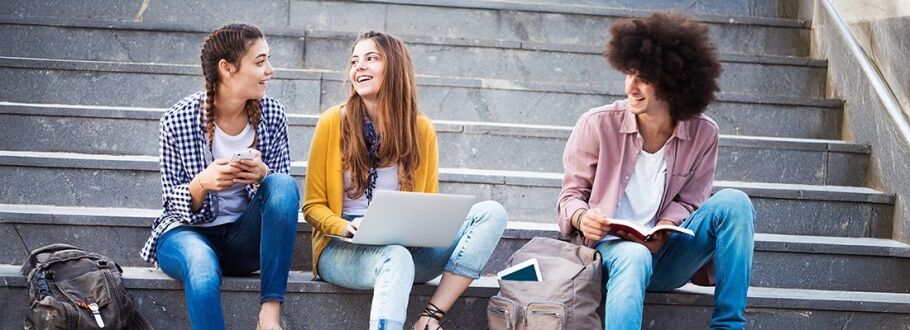 High school students studying on campus steps