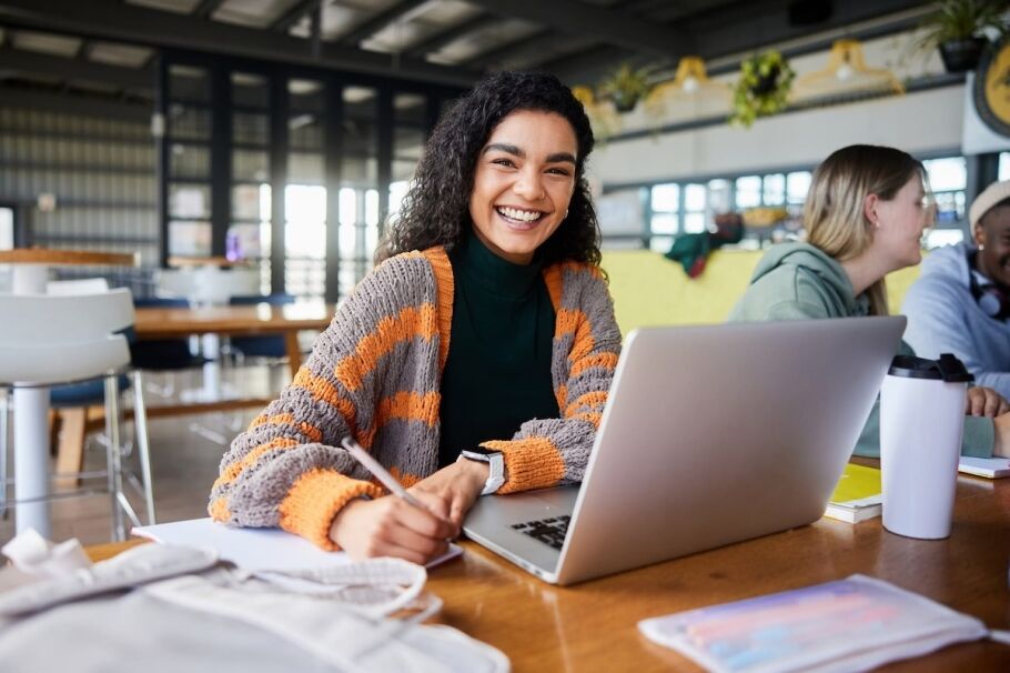 smiling woman working on laptop