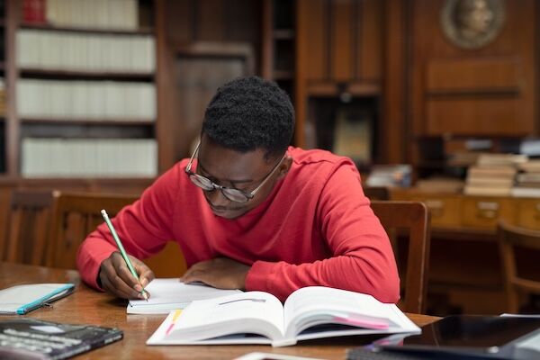 Student doing research in library