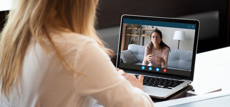 Student and alumni interview conducting virtual Harvard interview