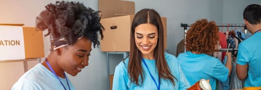 Students volunteering at a donation center, showcasing community involvement for college applications.