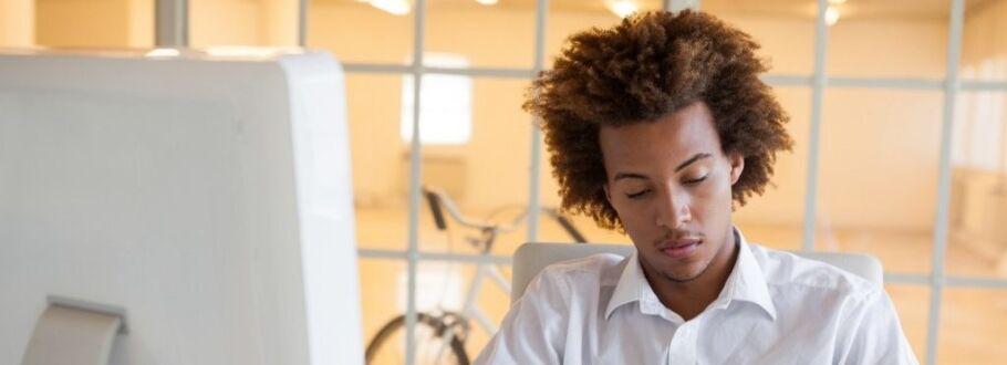 Student concentrating while studying or working on college application essay.
