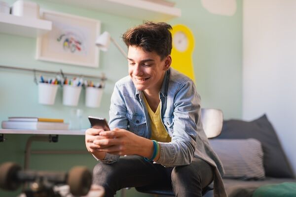 teenage boy using app on his phone
