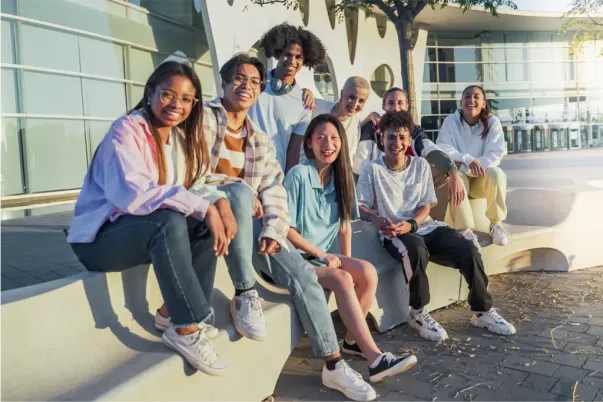 Diverse college students smiling, representing vibrant campus life and community