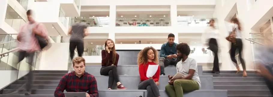 Multicultural study group in a modern university study  lounge.