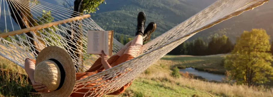 Student reading in hammock