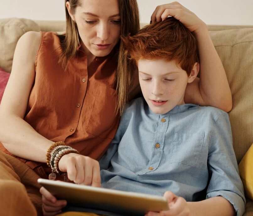 Child and parent reading together