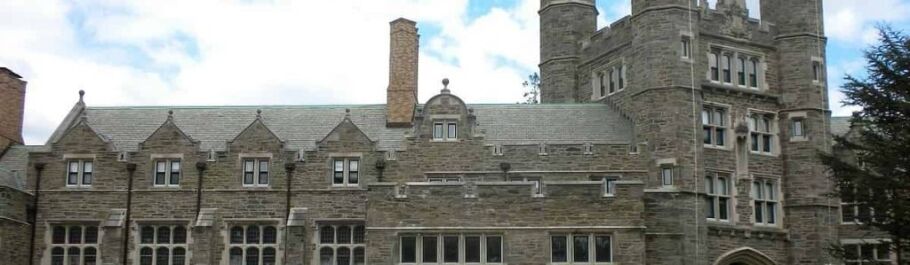 Classic stone architecture of a university building, symbolizing higher education.