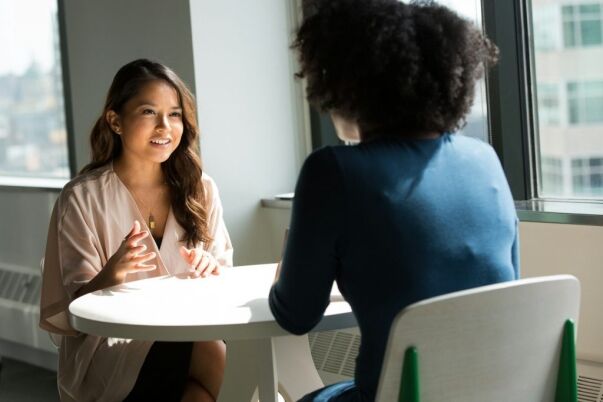 College counselor meets with student to discuss academic goals and planning.