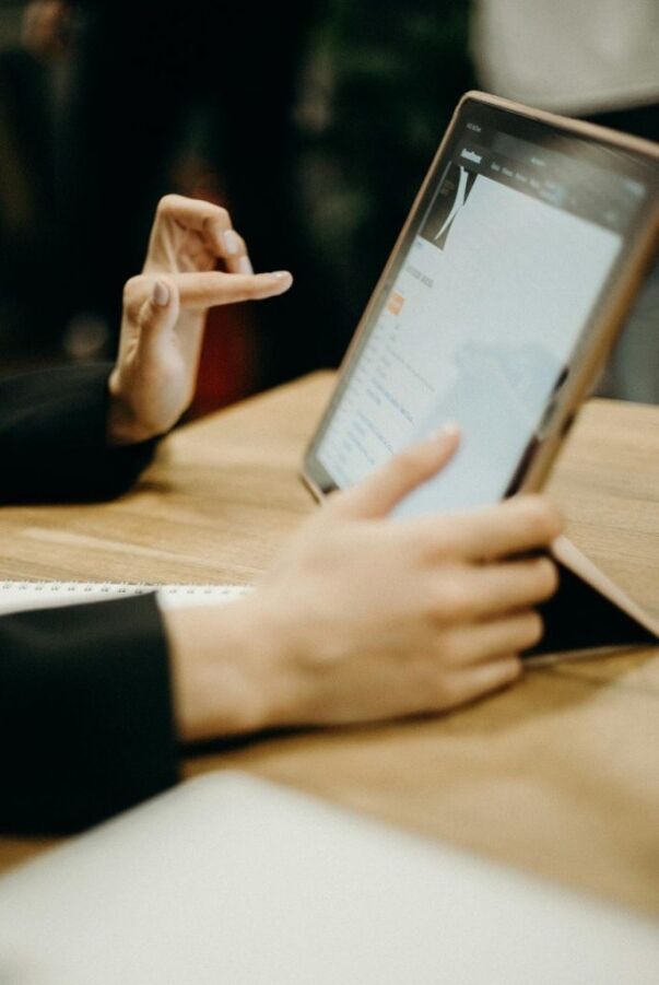 Student using a tablet for college application research and planning.