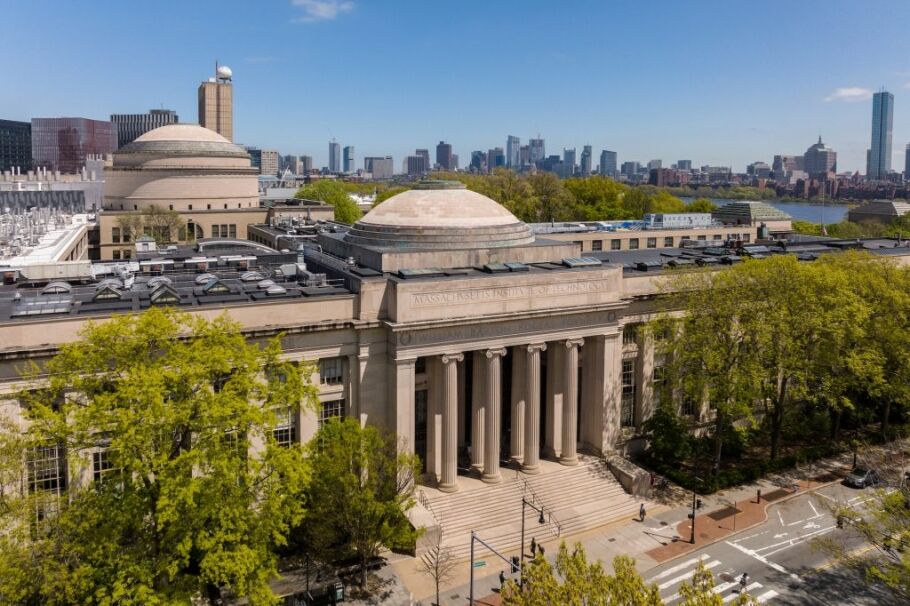 Aerial view of MIT's iconic architecture and Boston skyline, inspiring academic pursuits.