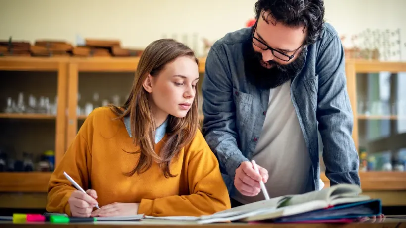 Student receiving personalized academic guidance for college preparation