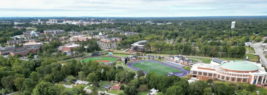 Scenic view of High Point University’s campus with tree-lined walkways and university buildings.