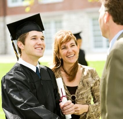 College graduate with family celebrating on campus
