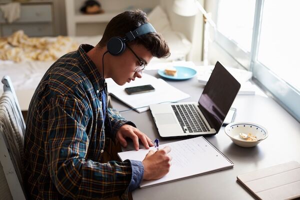 Student Writing a College Application Essay